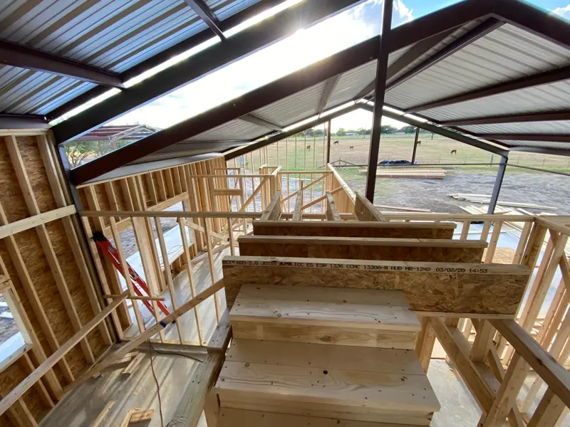 Loft framing with stairs going up.