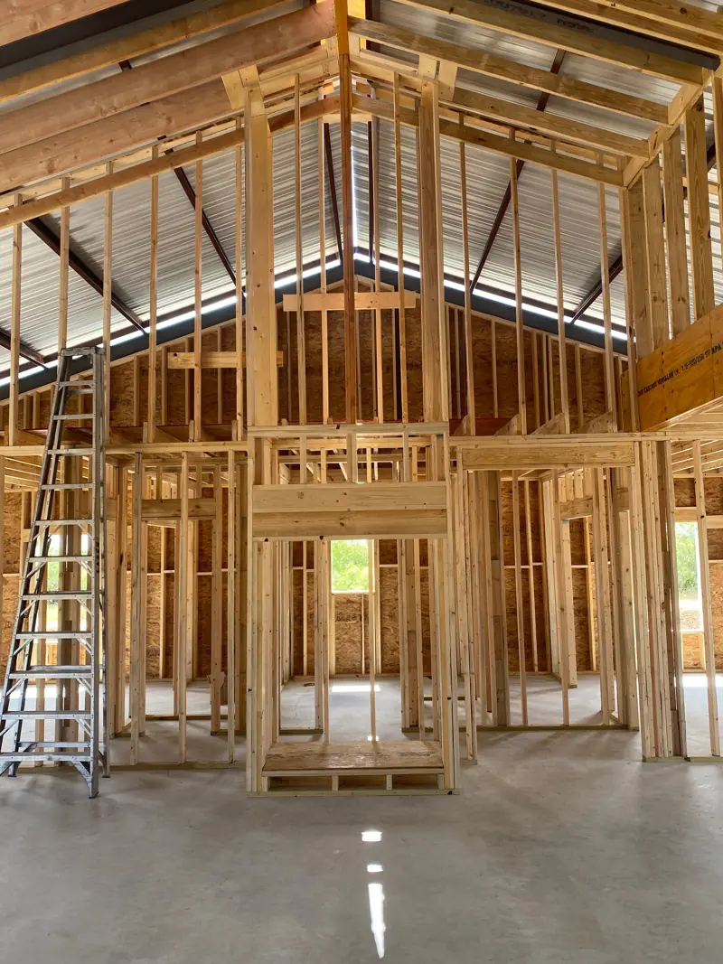 Main floor walls framed up to the gable end.