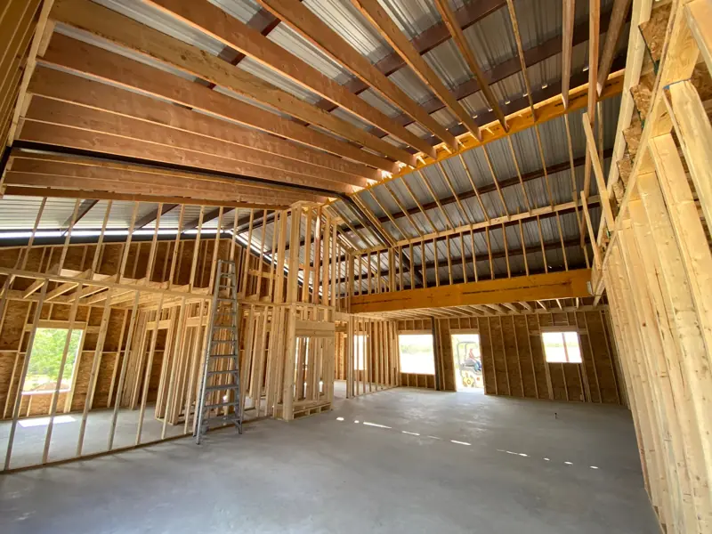 Main room framing with the edge of the loft above.
