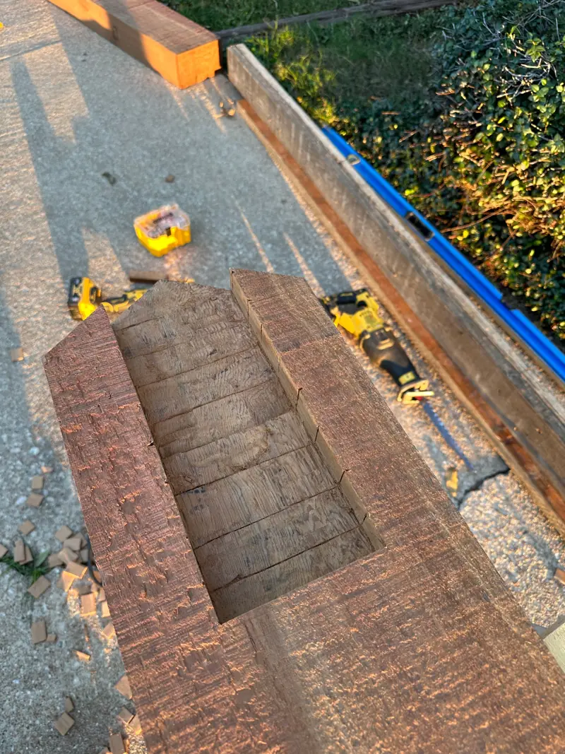 The old porch beam on the driveway after it came down.