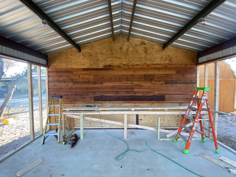 Reclaimed wood accent wall going up behind the counter framing.