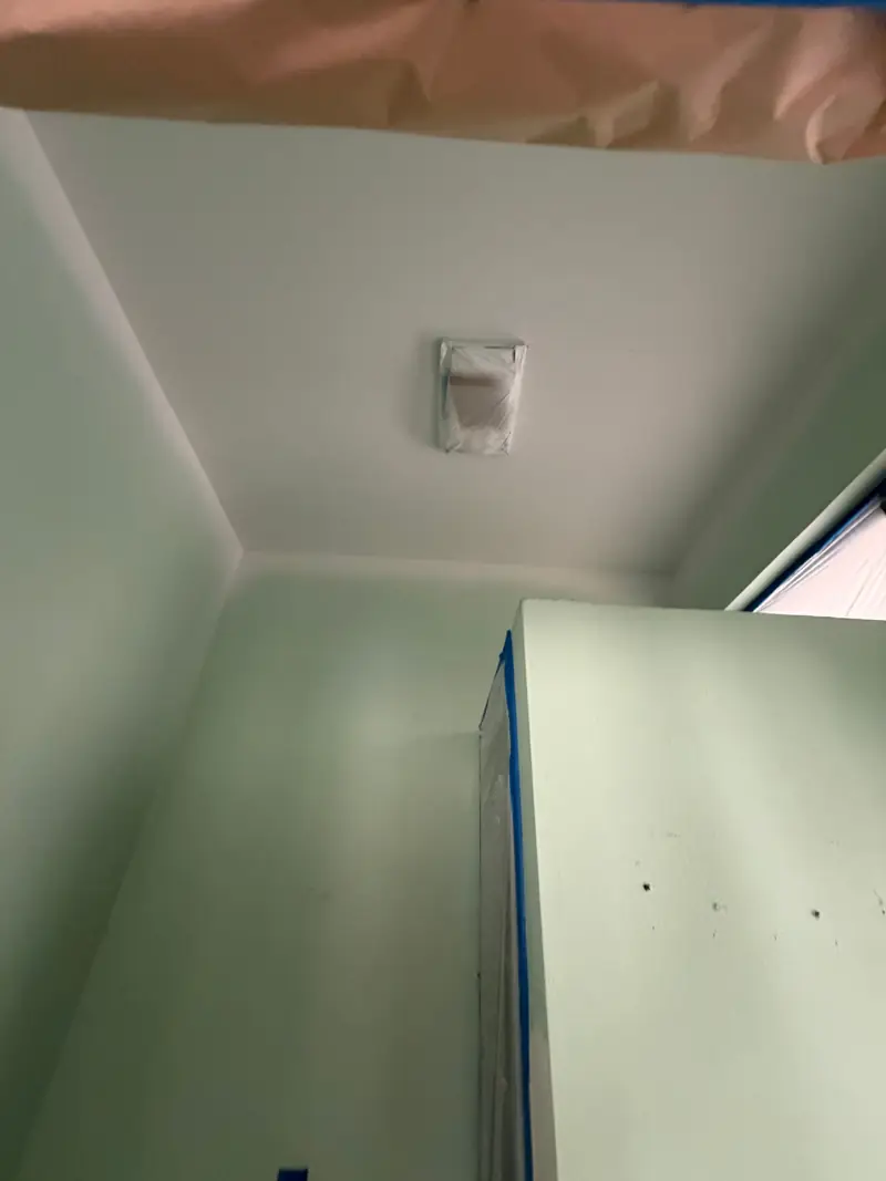 Ceiling painted, the walls masked and waiting.