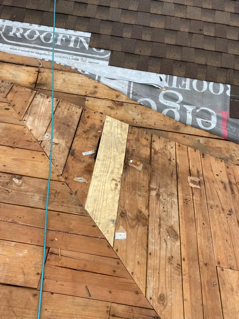 New board patched in at a valley.