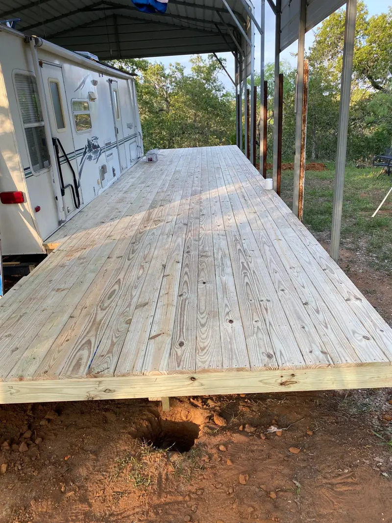 Deck boards down along the side of the RV.