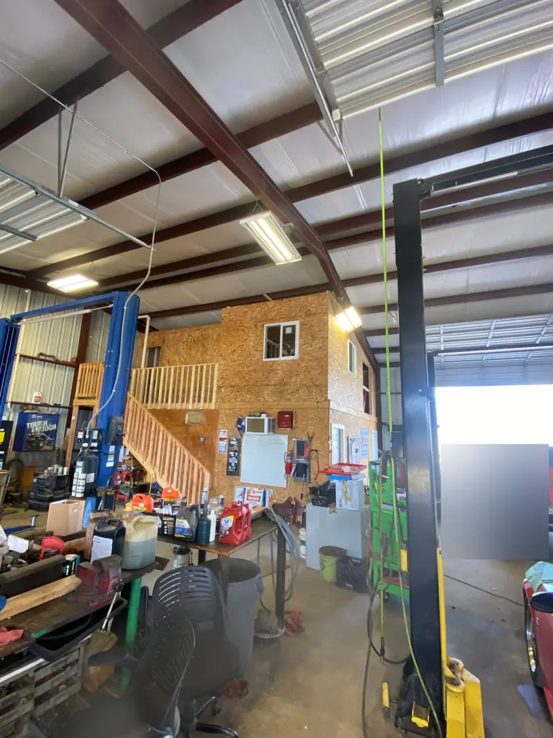 Shop view of the two-story office with stairs.